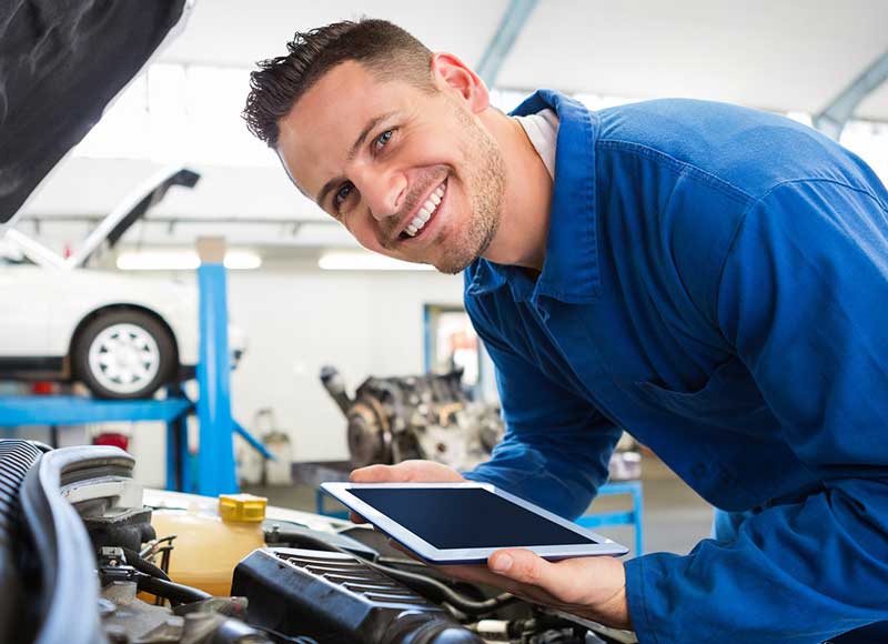 Mechanic holding a tablet