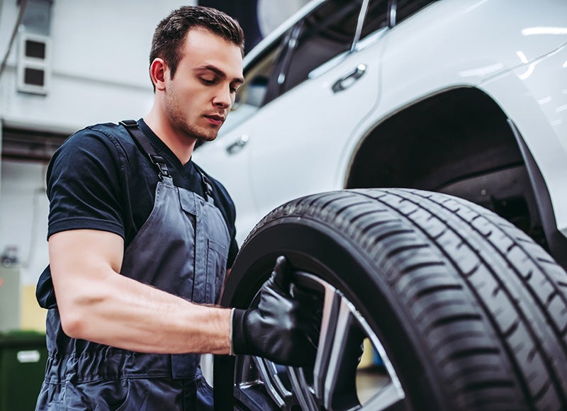 Mechanic holding a tire